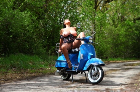 Brunette with big bosoms masturbates in a rough manner